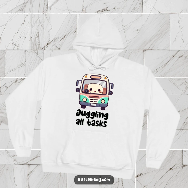 Funny hoodie featuring a Kawaii bus character juggling tiny steering wheels with its window eyes, showcasing impressive skill.
