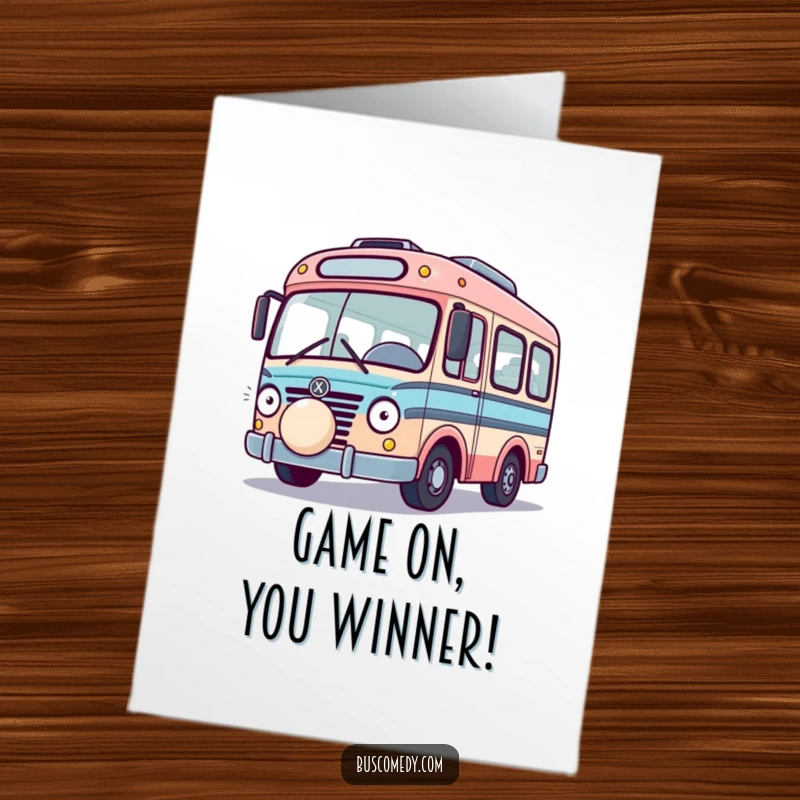 Free Printable Congratulations Card: A playful bus character is nudged by a bouncing ball, celebrating with fun energy.