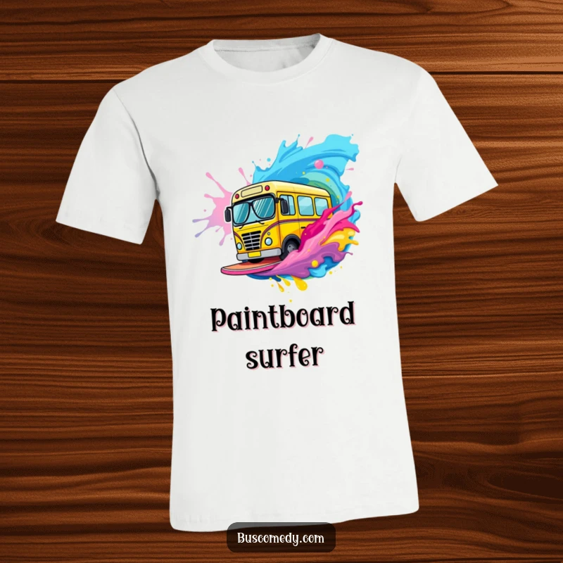 Funny bus character sporting tiny sunglasses surfs a big wave made of vibrant, colorful paint on this t-shirt.